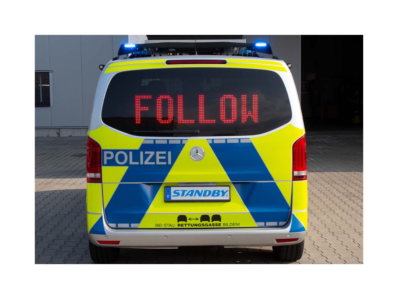 Message Display Sign in Back of Police Vehicle Showing the Message Follow