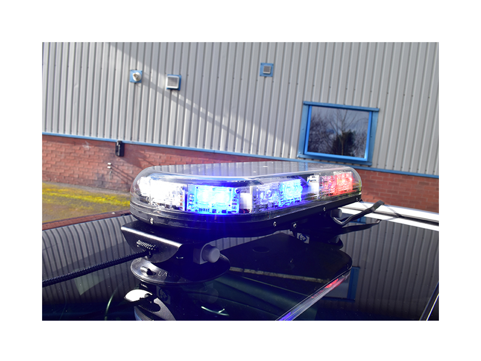 Trail Blazer 2 LED Mini Lightbar Clear Angle View Blue Red Lit In Situ on Black Car Roof 3