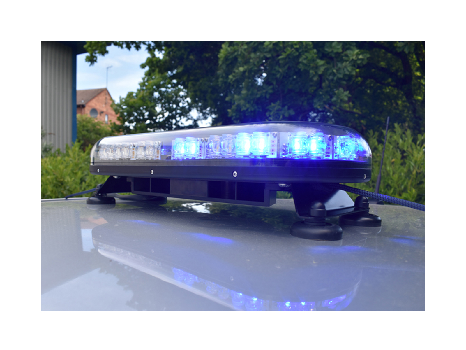 Trail Blazer 2 LED Mini Lightbar Half Blue Angle View Lit In Situ on Silver Car Roof 2