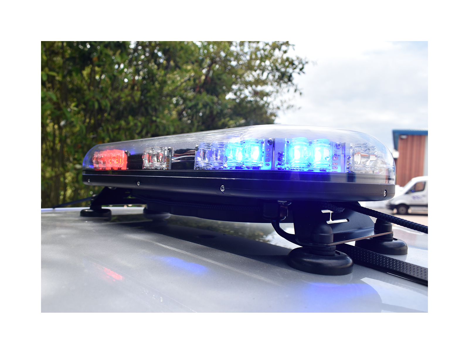 Trail Blazer 2 LED Mini Lightbar Half Blue Half Red Angle View Lit In Situ on Silver Car Roof 2